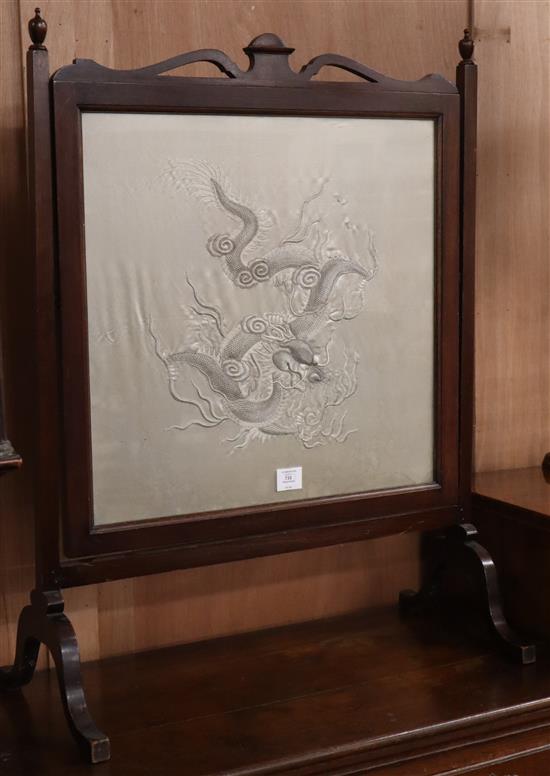 A Chinese couched and embroidered silk dragon firescreen W.69cm